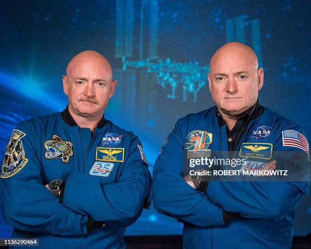 Recent photo released by NASA shows former astronaut Scott Kelly (R), who was the Expedition 45/46 commander during his one-year mission aboard the International Space Station, along with his twin brother, former astronaut Mark Kelly (L). The Twins Study, by the Journal Science, is helping scientists better understand the impacts of spaceflight on the human body through the study of identical twins. Retired astronaut Scott Kelly spent 340 days in low-Earth orbit aboard the International Space Station while retired astronaut Mark Kelly, his identical twin, remained on Earth. The twins' genetic similarity provided scientists with a reduced number of variables and an ideal control group, both important to scientific investigation. (Photo by Robert MARKOWITZ / NASA / AFP) (Photo by ROBERT MARKOWITZ/NASA/AFP via Getty Images)